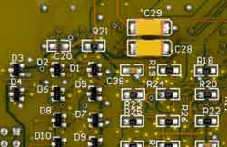 A typical surface mount board showing the different types of smaller components including resistors, transistors, etc.