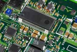 An image of a PC board containing surface mount components, showing the typical components used including ICs and other smaller components.