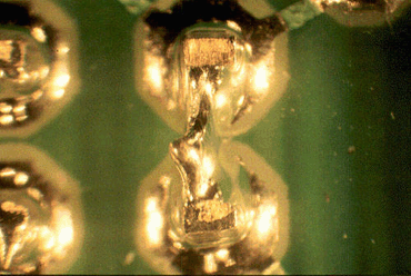 Figure 7: Poor solderability of bare tips caused these solder spikes and subsequent short